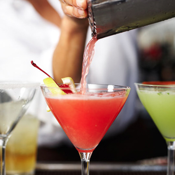Cocktail being poured at Mustards Grill
