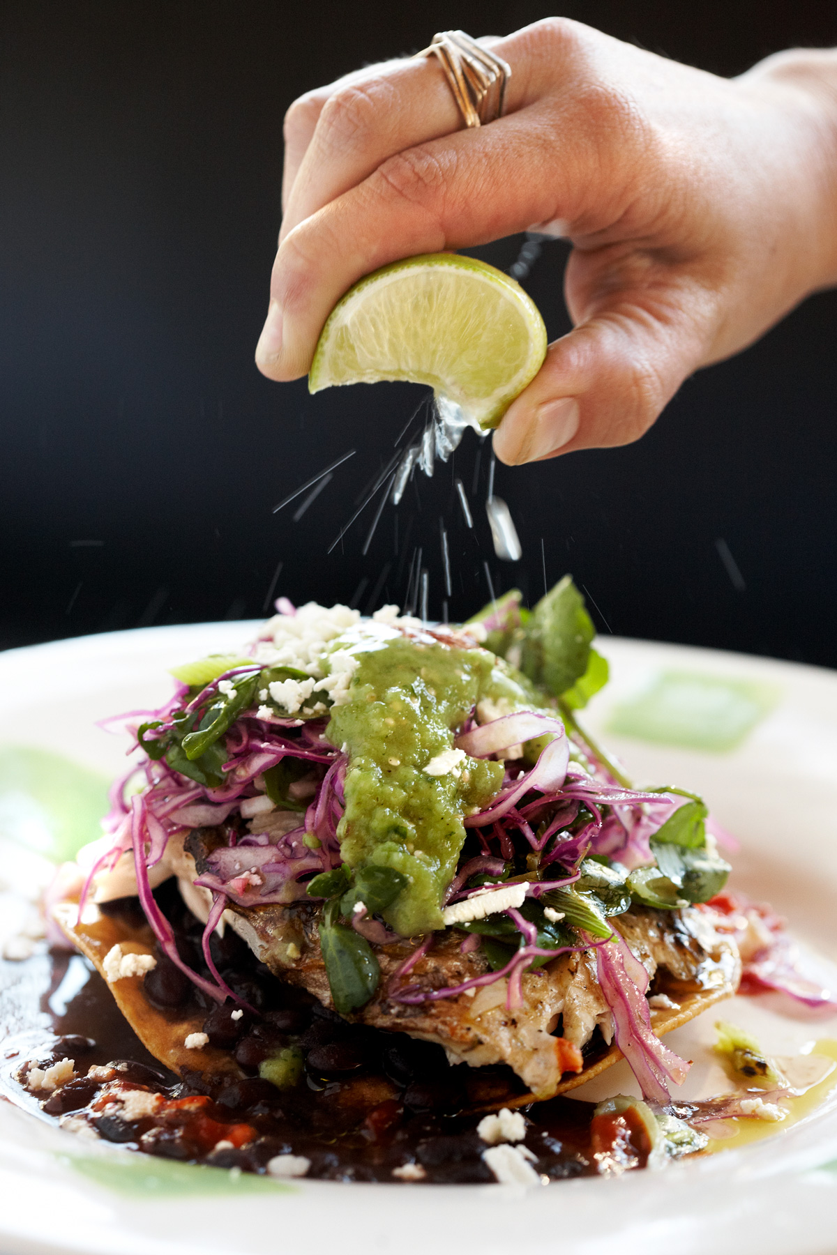 Mustards Grill tostada prepared for takeout